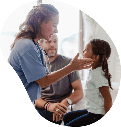 Medical professional examining a young female patient